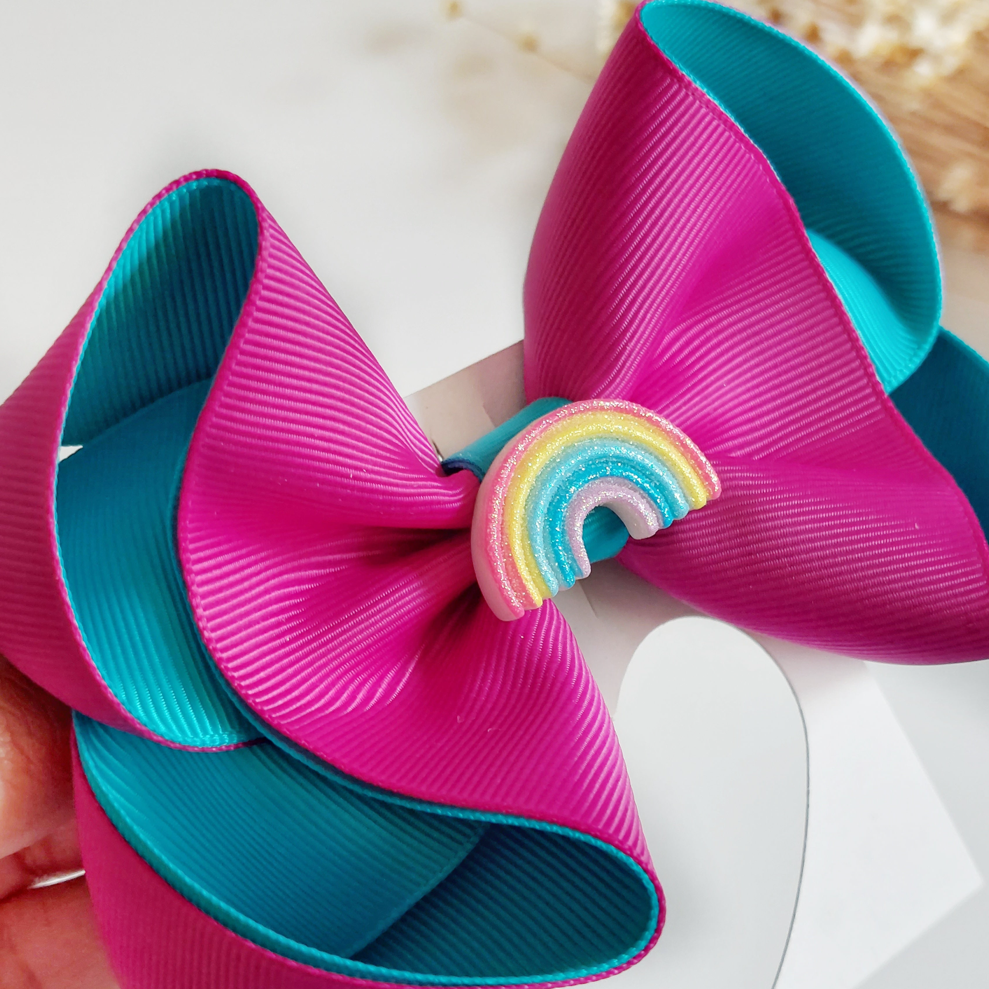 Turquoise rainbow bow