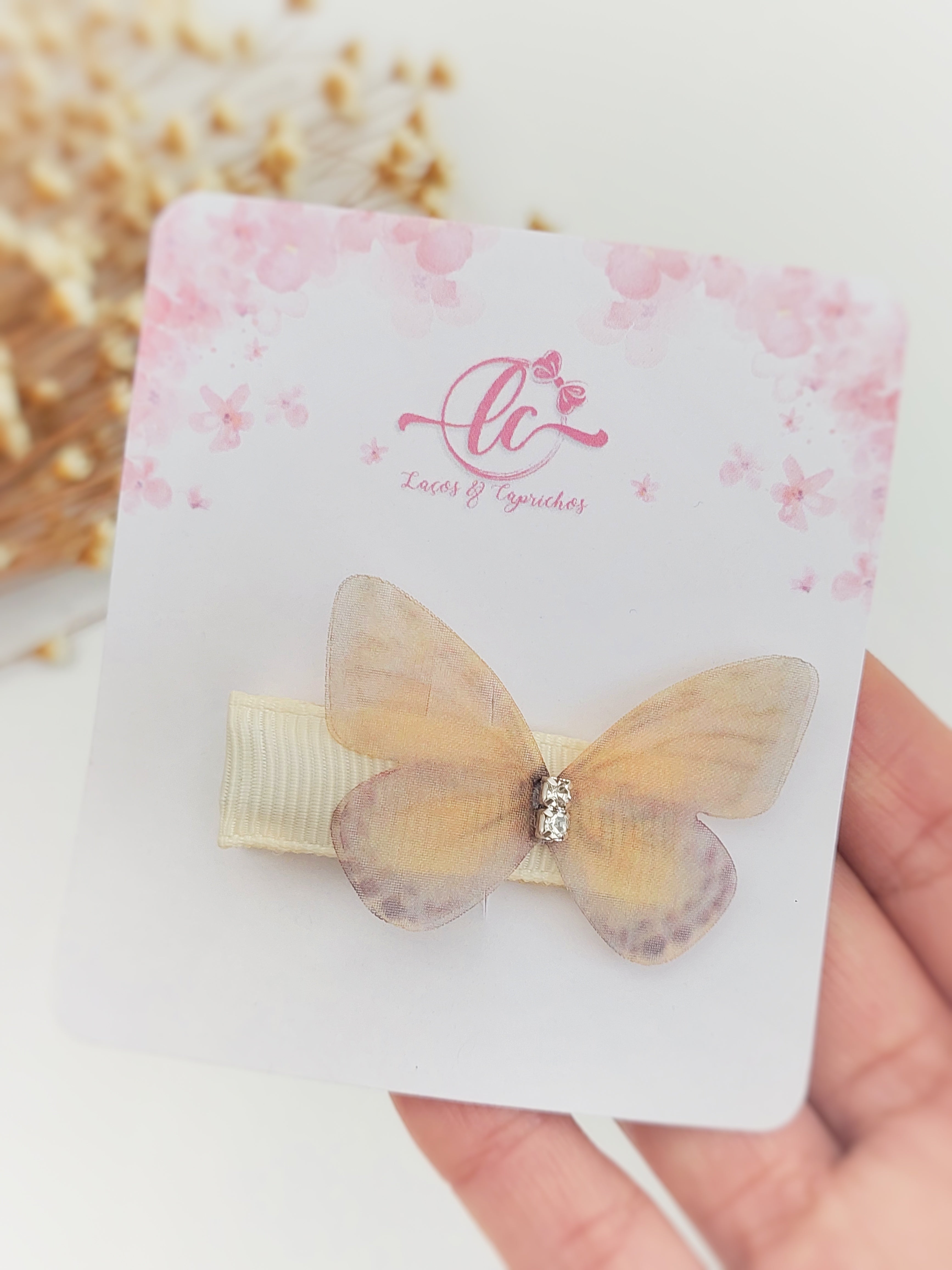Gancio per neonati a forma di farfalla: accessorio delicato e sicuro