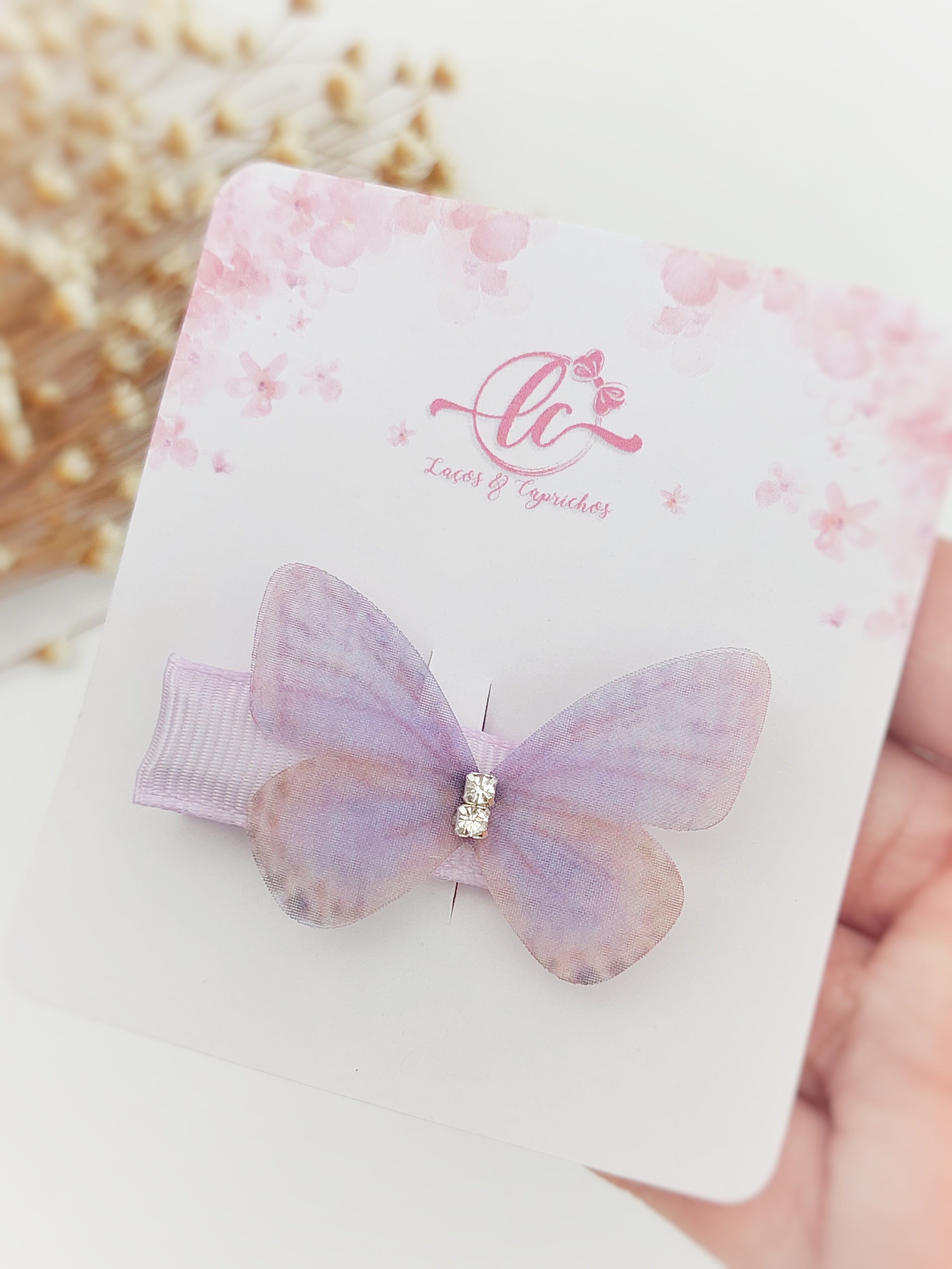 Gancio per neonati a forma di farfalla: accessorio delicato e sicuro